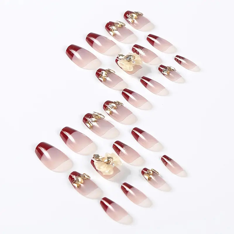 Elegant Red and Nude Gradient Press-On Nails with Gold Embellishments