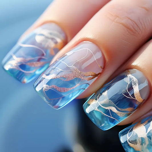 Ocean-Inspired Blue Nails with Gold Wave